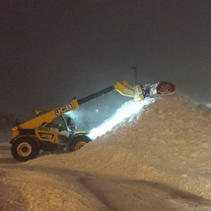 large machinery moving snow