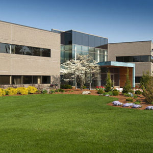 building with landscaped front lawn